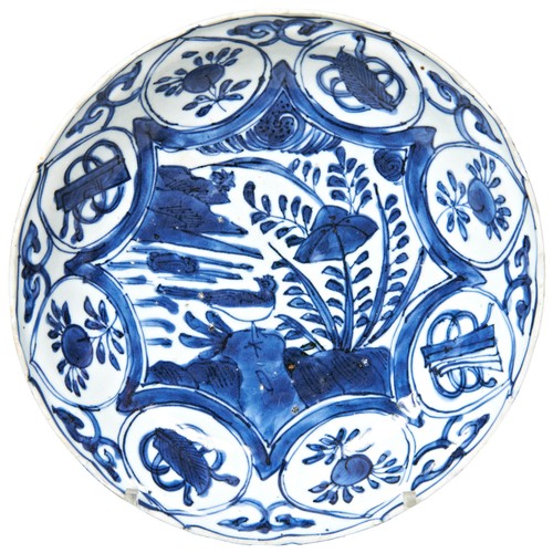 75 - BLUE AND WHITE DISHWANLI PERIOD (1573-1619)painted in tones of blue with a bird perched on a verdant... 