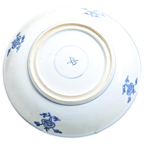 93 - A LARGE BLUE & WHITE 'PEONY' DISHKANGXI PERIOD (1662-1722)painted throughout in underglaze blue ... 