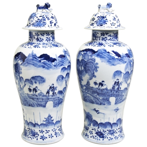 124 - PAIR OF BLUE AND WHITE VASES & COVERSQING DYNASTY, 19TH CENTURY the baluster sides finely painte... 