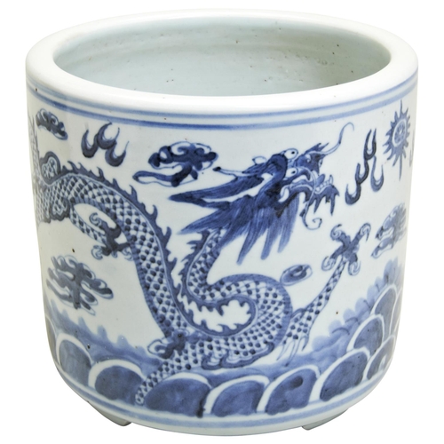 130 - A BLUE AND WHITE DRAGON CENSER20TH CENTURYthe cylindrical sides painted in tones of underglaze blue ... 