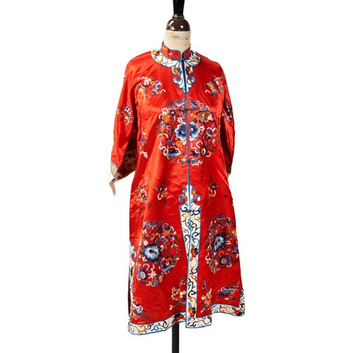 AN EMBROIDERED RED SILK WOMAN'S INFORMAL ROBE20TH CENTURYthe robe ...