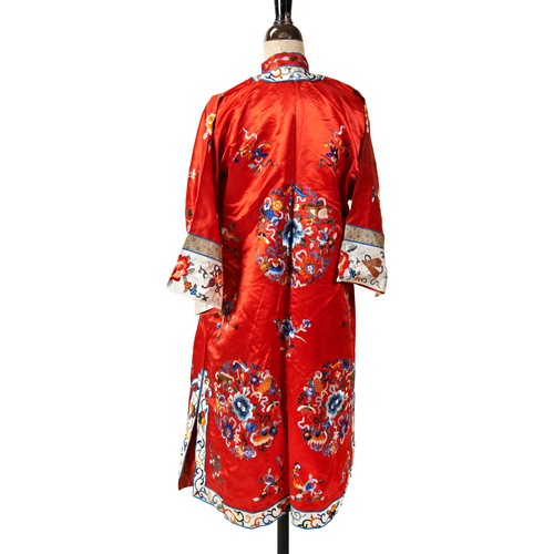 AN EMBROIDERED RED SILK WOMAN'S INFORMAL ROBE20TH CENTURYthe robe ...