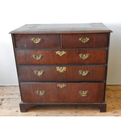 3 - A GEORGE III WALNUT CHEST OF DRAWERS, CIRCA 1790, moulded edge top above two short drawers and three... 