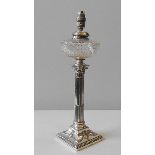 96 - A LATE VICTORIAN SILVER PLATED CUT GLASS OIL LAMP, CIRCA 1896, cut glass reservoir sat atop an elega... 