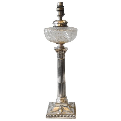 96 - A LATE VICTORIAN SILVER PLATED CUT GLASS OIL LAMP, CIRCA 1896, cut glass reservoir sat atop an elega... 