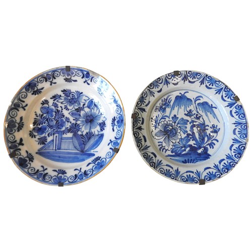 124 - TWO LARGE BLUE & WHITE DELFT PLATES, 18TH CENTURY, both decorated with similar floral and foliat... 