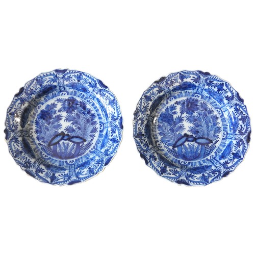 126 - A PAIR OF DELFT BLUE & WHITE PLATES, LATE 18TH / EARLY 19TH CENTURY, barbed rims, decorated with... 