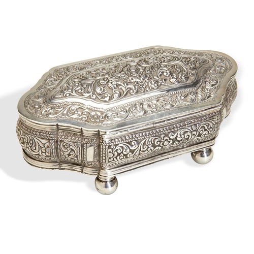 128 - A SILVER CASKET, SRI LANKA C.1880. The body and lid chased all around with typically deep scrolls an... 