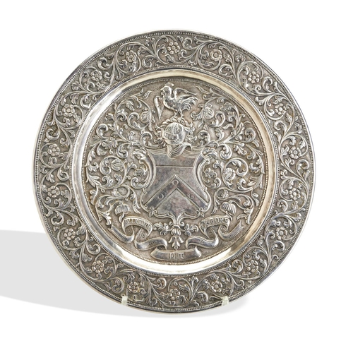 131 - A SILVER DISH WITH CHASED ARMS, KUTCH INDIA C.1880. A waiter chased with a full coat of arms and mot... 