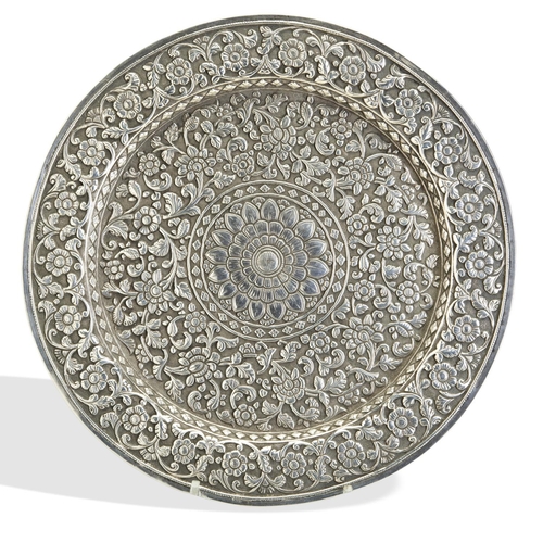 132 - A SILVER SALVER ON FOUR FEET, KUTCH INDIA, C.1850. The reverse of the salver bears the inscription 