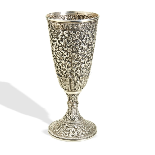 139 - A LARGE KUTCH SILVER GOBLET INDIA C.1880. An unusually tall goblet made in Bhuj and chased all over ... 