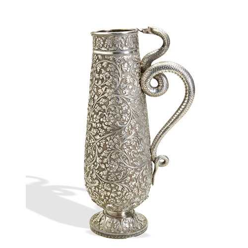 143 - A LARGE KUTCH SILVER JUG WITH SNAKE HANDLE C.1880. A heavy and well chased jug from the town of Bhuj... 