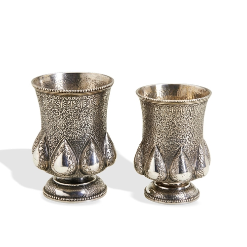 145 - TWO SILVER BEAKERS, RAJASTHAN C.1860. Both these matching beakers are decorated with flora and an an... 