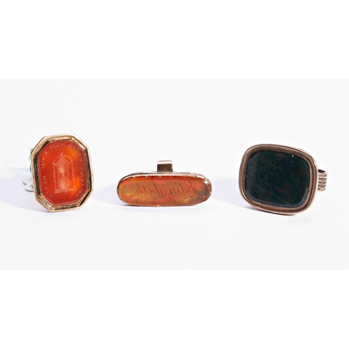 367 - A GEORGIAN YELLOW METAL CARNELIAN FOB SEAL, along with two other hardstone fob seals (untested)PROVE... 