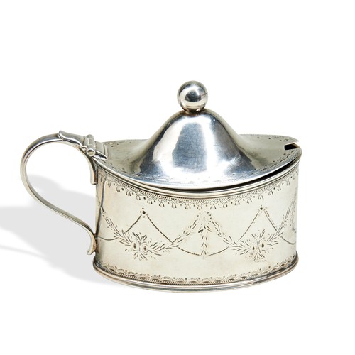 258 - A GEORGE III SILVER MUSTARD POT, oval form with bright cut engraved tied festoon decoration, with hi... 