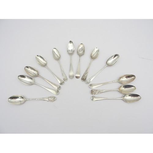 259 - AN ASSORTMENT OF TWELVE SCROLL BACK SILVER TEASPOONS, late 18th / early 19th century, including thre... 