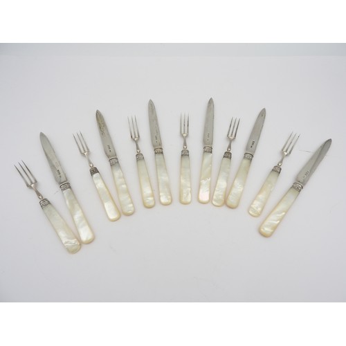 267 - A SET OF SIX SILVER MOTHER OF PEARL HANDLED FRUIT KNIVES AND SIX MATCHING FORKS, with scroll foliate... 