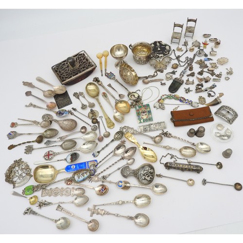 283 - A LARGE ASSORTMENT OF SILVER SPOONS, SILVER CHARMS AND OTHER SUNDRY SILVER ITEMS, including silver m... 