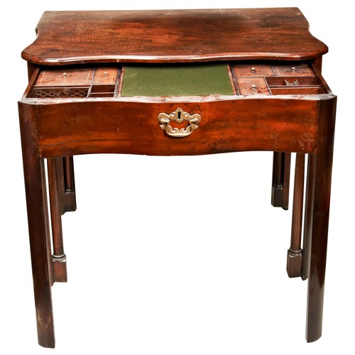 57 - A GOOD GEORGE III MAHOGANY SERPENTINE WRITING TABLE, CIRCA 1760, the shaped top with moulded edge, a... 