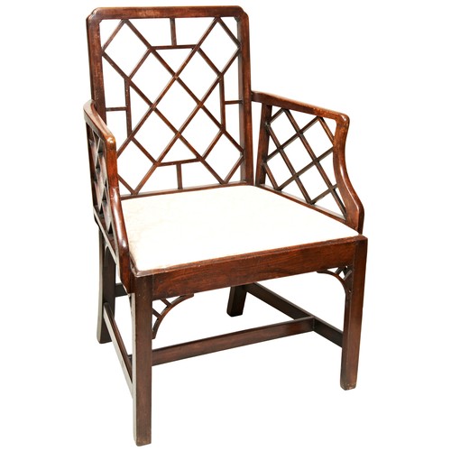 61 - A GEORGE III MAHOGANY COCKPEN CHAIR, CIRCA 1775, in the manner of Thomas Chippendale, the trellis ba... 