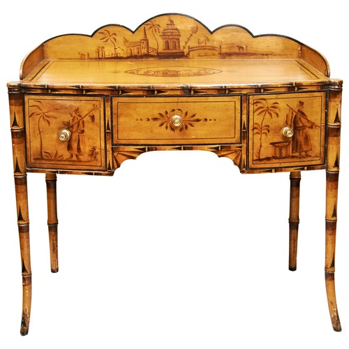 64 - A REGENCY SIMULATED BAMBOO AND CHINOISERIE DRESSING TABLE, CIRCA 1820, the shaped three quarter gall... 