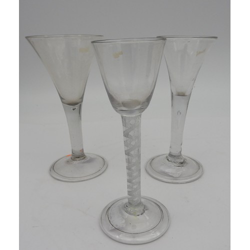 120 - A GEORGE III WINE GLASS, CIRCA 1800, heavy baluster bowl on a multiple series air twist stem, raised... 