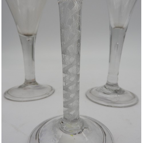 120 - A GEORGE III WINE GLASS, CIRCA 1800, heavy baluster bowl on a multiple series air twist stem, raised... 