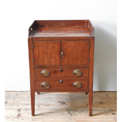 4 - A GEORGE III MAHOGANY TRAY TOP NIGHT STAND, CIRCA 1820, galleried top above two cupboard doors, the ... 