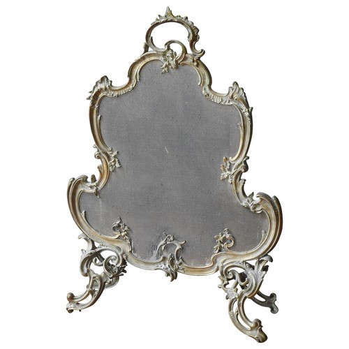 99 - A FRENCH 19TH CENTURY BRASS & IRON CARTOUCHE SPARK GUARD, in the Rococo style, raised on four or... 