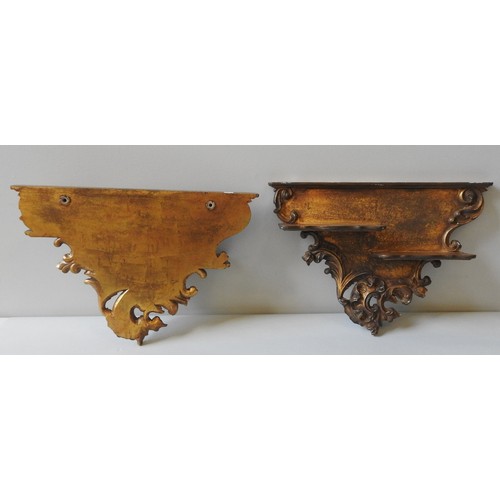 97 - A PAIR OF ITALIAN STYLE GILT WOOD WALL BRACKETS, EARLY 20TH CENTURY, split level shelves mounted on ... 