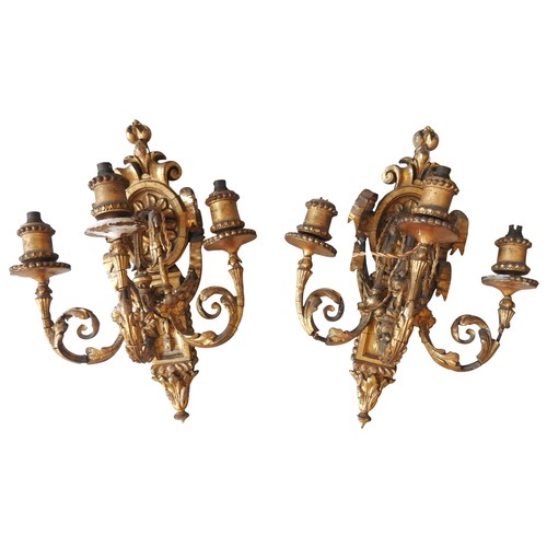 95 - A PAIR OF ORNATE GILT WOOD TRIPLE LIGHT WALL SCONCES, EARLY 20TH CENTURY, three scroll foliate branc... 