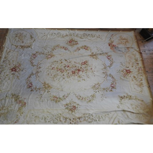 76 - A LARGE AUBUSSON RUG, 20TH CENTURY, central cream cartouche decorated with floral sprays and surroun... 