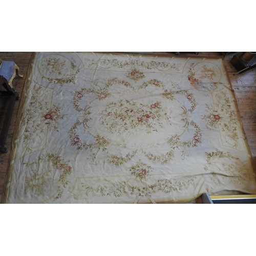 76 - A LARGE AUBUSSON RUG, 20TH CENTURY, central cream cartouche decorated with floral sprays and surroun... 