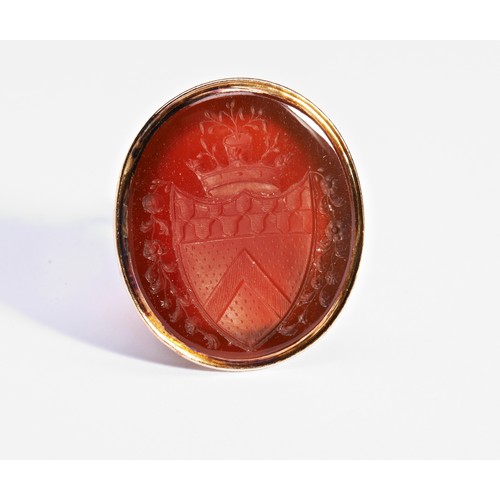 370 - A GEORGIAN YELLOW METAL FOB SEAL, CIRCA 1820, with an oval carnelian intaglio armorial (untested)PRO... 