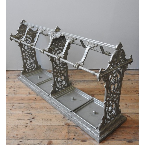 78 - AN IMPRESSIVE VICTORIAN CAST-IRON STICK STAND, CIRCA 1880, three cruciform panels united by a centra... 