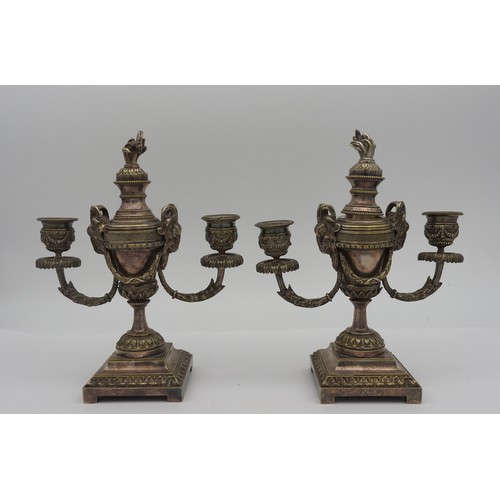 410 - A PAIR OF SILVERED BRONZE CASSOLETS/ CANDELABRA, LATE 19TH CENTURY, campagna form surmounted by a to... 