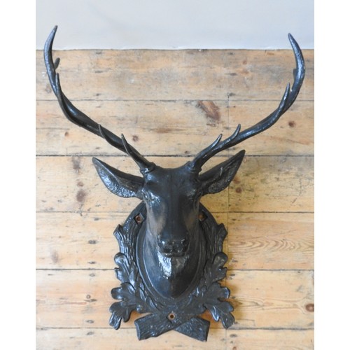 82 - AN IMPRESSIVE CAST-IRON WALL MOUNTED STAG'S HEAD, EARLY 20TH CENTURY, with five point antlers, natur... 