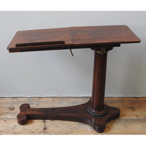 5 - A EARLY VICTORIAN ROSEWOOD BED TABLE, the fluted edge rounded rectangular top in two sections, one w... 