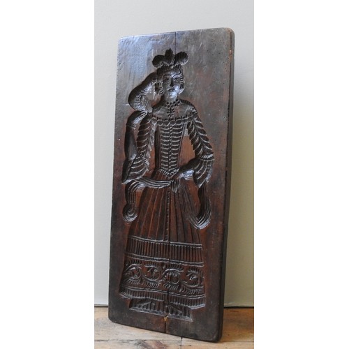 409 - AN 18TH CENTURY FRUITWOOD GINGER BREAD MOULD, one side carved with a depiction of nobleman with houn... 