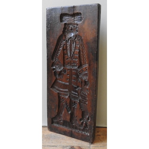 409 - AN 18TH CENTURY FRUITWOOD GINGER BREAD MOULD, one side carved with a depiction of nobleman with houn... 