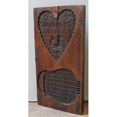 408 - A DUTCH 18TH CENTURY FRUITWOOD GINGERBREAD MOULD, one side carved with royal horse drawn carriage sc... 