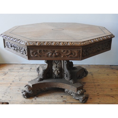 19 - AN IMPRESSIVE 19TH CENTURY CARVED OAK OCTAGONAL CENTRE TABLE, in the Gothic Revival style, the carve... 