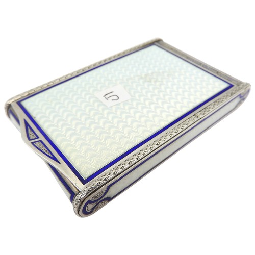 416 - A VINTAGE FRENCH SILVER GILT ENAMELLED COMPACT, CIRCA 1935, rectangular form, the hinged lid opening... 