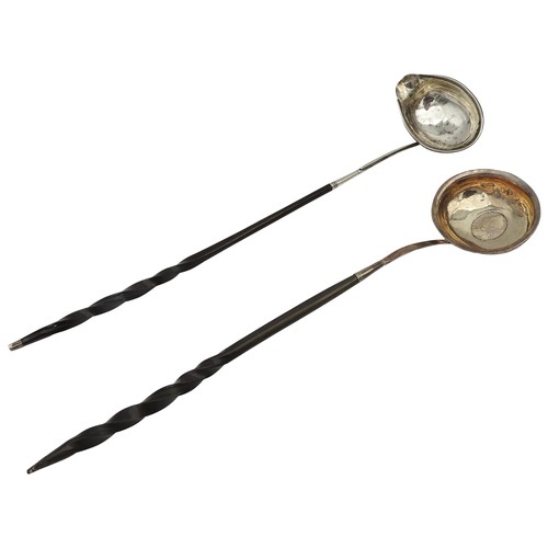 231 - TWO GEORGE III SILVER TODDY LADLES, both with twist handles, one inset with a George II silver shill... 