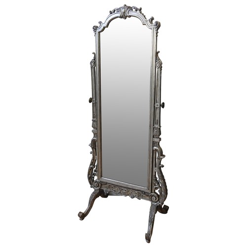 90 - A SILVERED CHEVAL MIRROR, EARLY 20TH CENTURY, the arch top adjustable plate mounted on a rococo styl... 