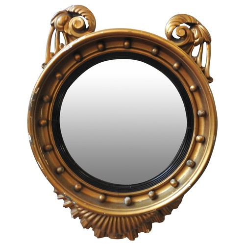 91 - A LATE VICTORIAN GILT FRAMED CONVEX MIRROR, CIRCA 1880, the circular convex plate in a gilt gesso fr... 