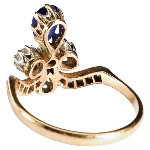 307 - AN ART NOUVEAU SAPPHIRE AND DIAMOND RING, CIRCA 1900the pear-cut sapphire eight claw set below a tre... 