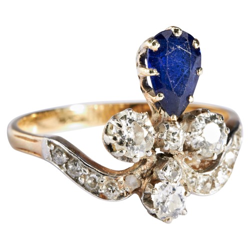 307 - AN ART NOUVEAU SAPPHIRE AND DIAMOND RING, CIRCA 1900the pear-cut sapphire eight claw set below a tre... 