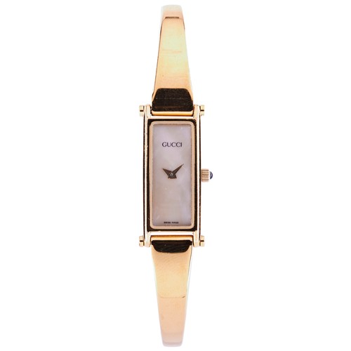 339 - GUCCI, A GOLD PLATED LADIES WRISTWATCHSigned Mother of Pearl dial, the model 1500P with quartz movem... 