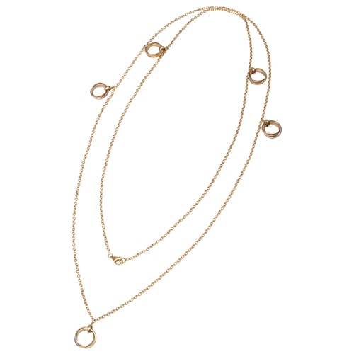 287 - CARTIER; AN 18 CARAT GOLD TRINITY NECKLACEthe long chain spaced with five Trinity rings each of whit... 